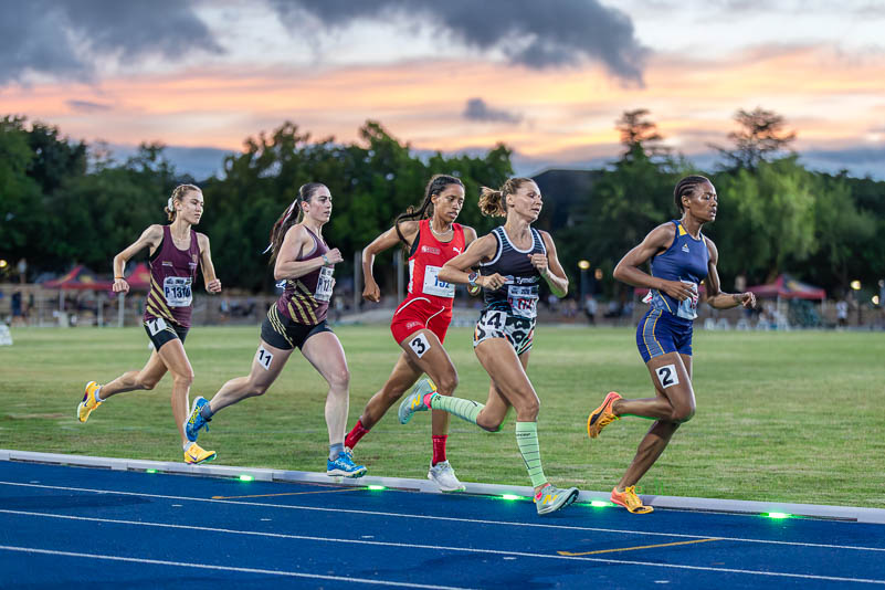 emale Athletes Competing in a Track Race | Performance Coaching Female athletes competing in a middle-distance track race, demonstrating focus, resilience and peak performance under pressure, qualities developed through performance coaching.